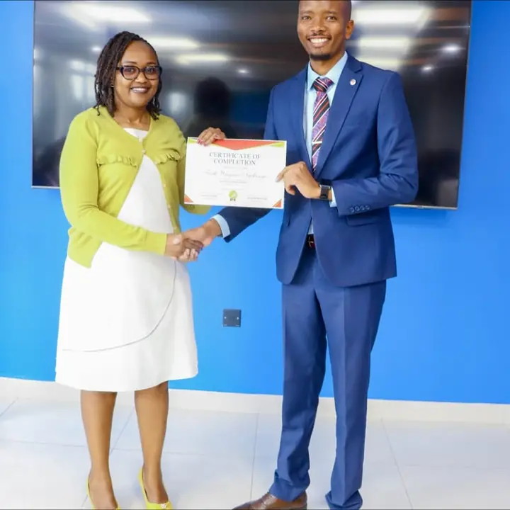 Cephas presenting a certificate to a participant