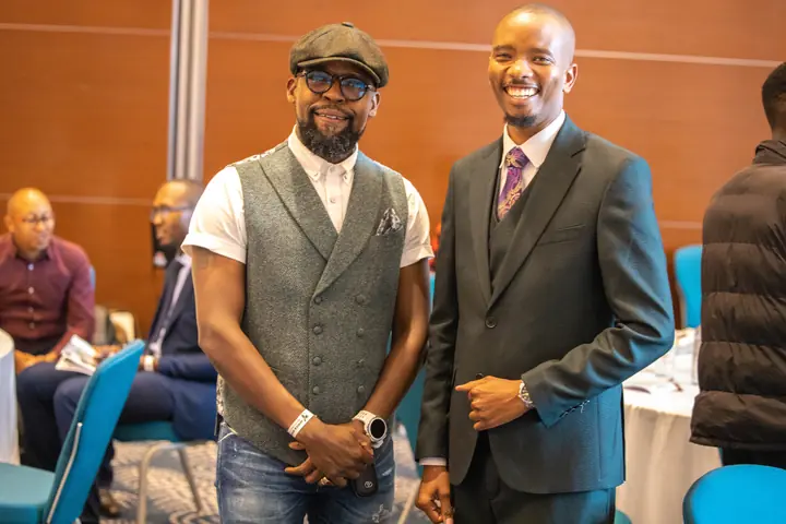Cephas with a fellow professional at a business event