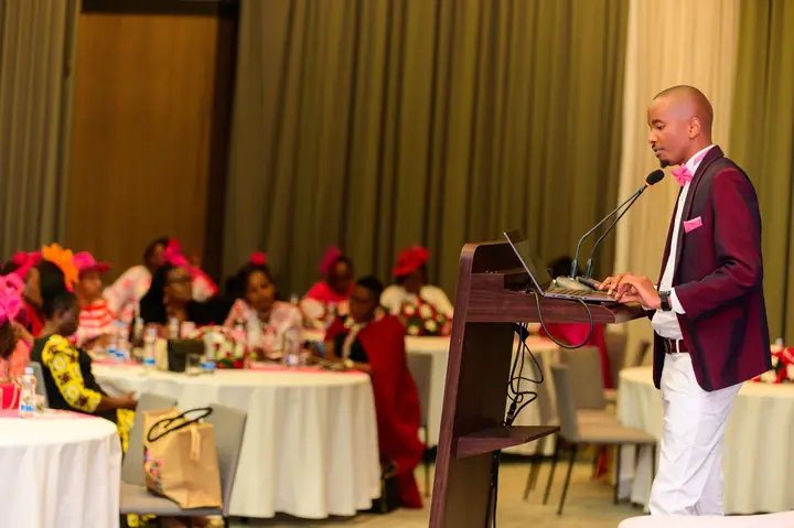 Cephas speaking to guests seated at conference tables