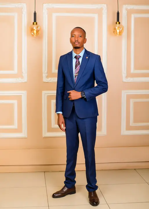 Portrait of Cephas Gathii in a navy suit