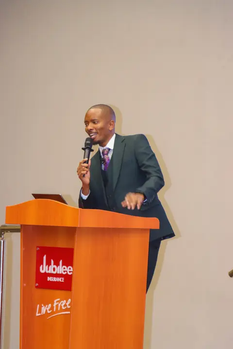 Cephas speaking from a podium